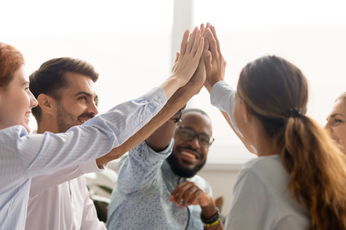 group of people giving high fives