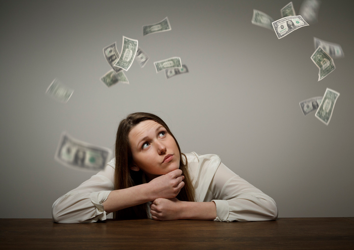 Girl in white and dollars.