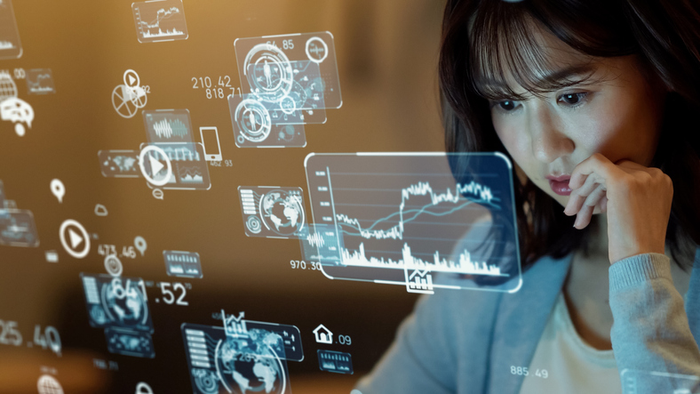Asian woman watching hologram screens. Business and technology concept. Smart office. GUI (Graphical User Interface).
