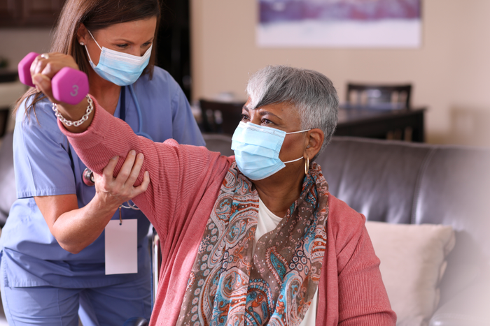 Senior adult woman and home health care nurse.