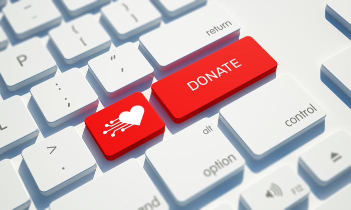 Red donate button on a computer keyboard