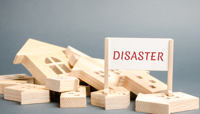 A poster with the inscription Disaster and fallen wooden houses. Urgent evacuation of people. Hurricane. Storm. Fire. Explosion. The flood. Collapse. Threat to people's lives. Emergency housing status