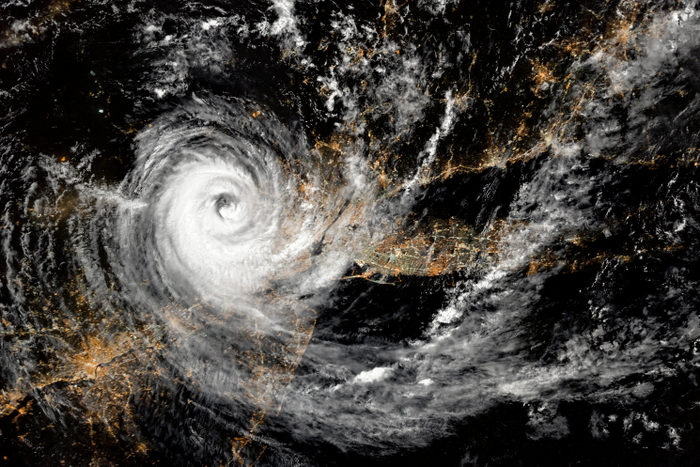 Hurricane over northeastern United States at night. New York City and Newark, New Jersey. Long Island. Aerial view. Elements of this image furnished by NASA.