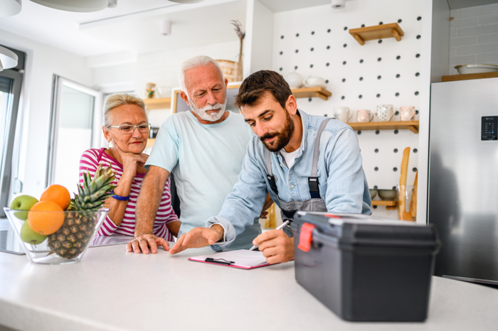false Repairman gives repair estimate to a senior couple